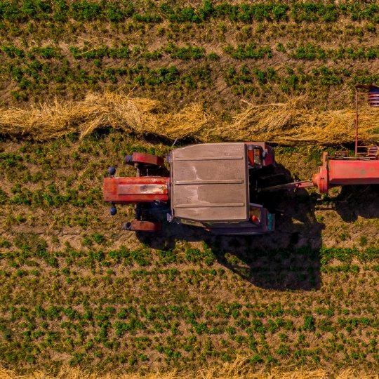 aerial-drone-view-harvester-gathering-crops